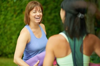 Two mature women talking before doing yoga in the summer-1_11zon